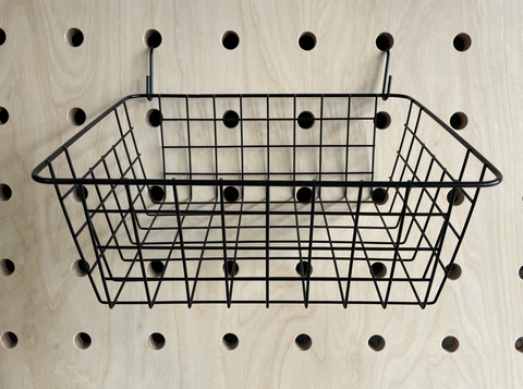 black wire hanging basket for wooden pegboard by kreisdesign