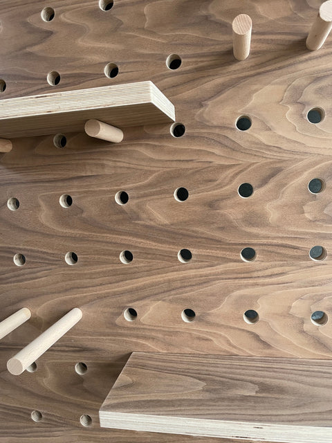 detail of walnut pegboard by kreisdesign