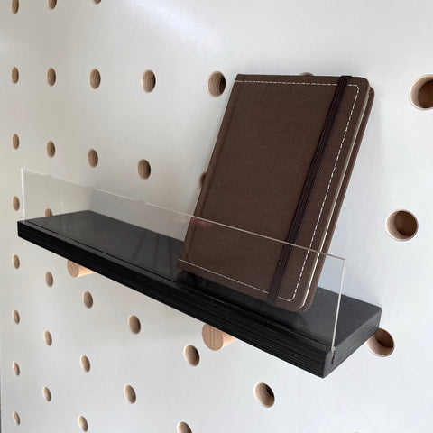 Black shelf with clear front for pegboards