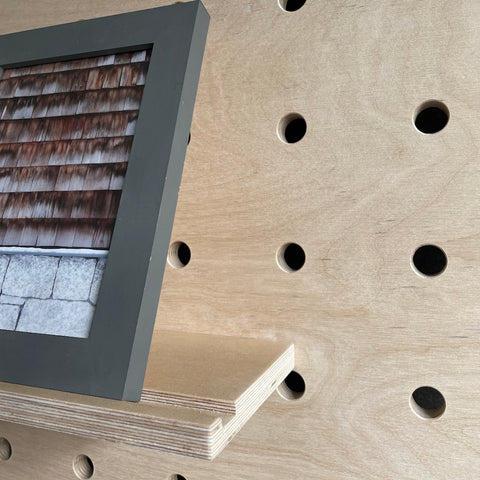 plywood shelf with groove for kreisdesign pegboards with leaning frame - groove prevents picture frame to slid off