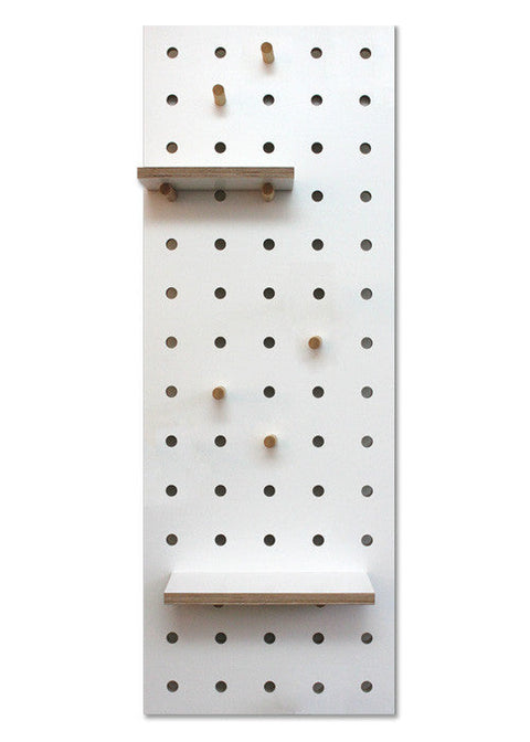 white wood pegboard with shelves and pegs