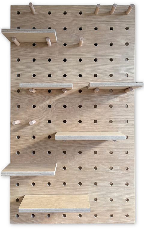 large wooden pegboard finish in oak with wooden shelves and solid pegs