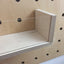 detail of wooden box with clear front for pegboard