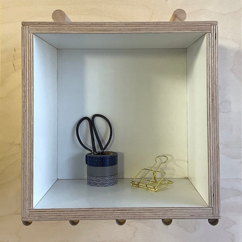 large wooden box for pegboards