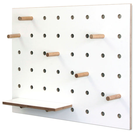 small white wood pegboard for storage on shelves and pegs