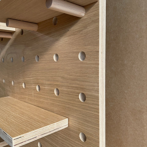 Detail oak pegboard edges with layers of birch plywood
