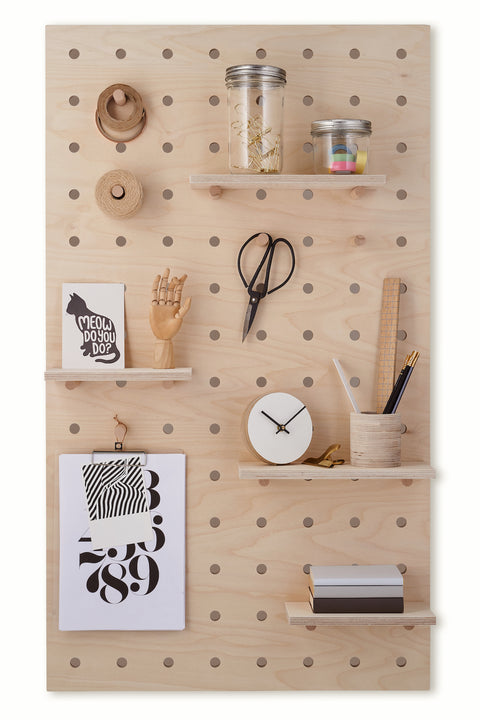 Large wooden pegboard with shelves and pegs made from birch plywood by Kreisdesign