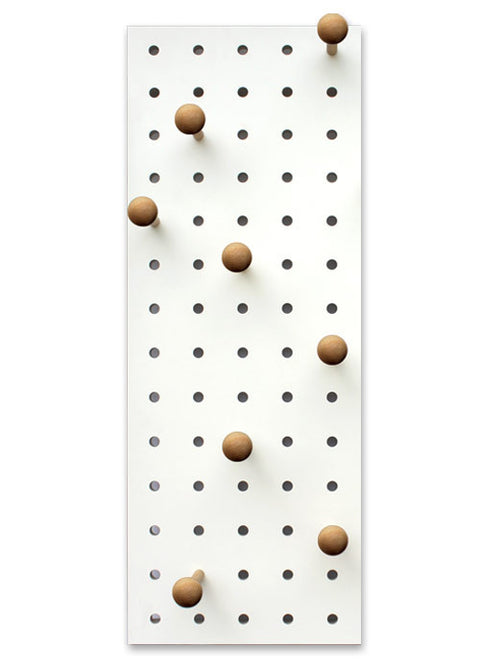 white wood pegboard with pegs hooks