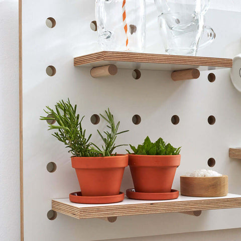 white wooden shelf for pegboard