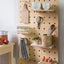 Large wooden pegboard with shelves and pegs made from birch plywood by Kreisdesign