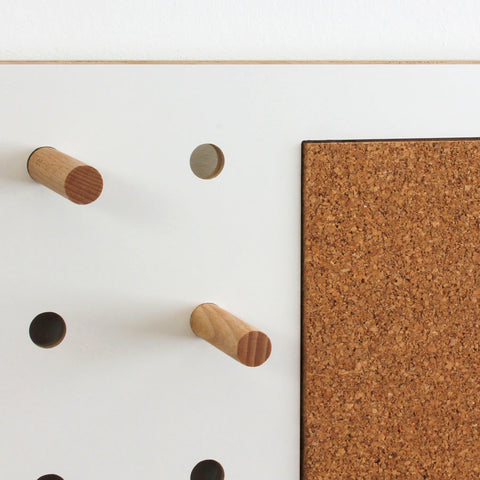 white pegboard cork pin board