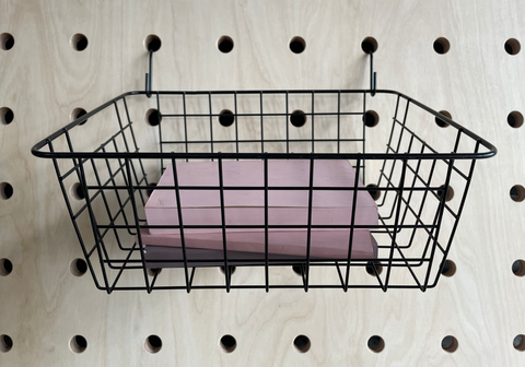 black wire basket with books for pegboard by kreisdesign