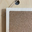 detail plywood cork pin board - frame edge with leather string to hang from pegboard