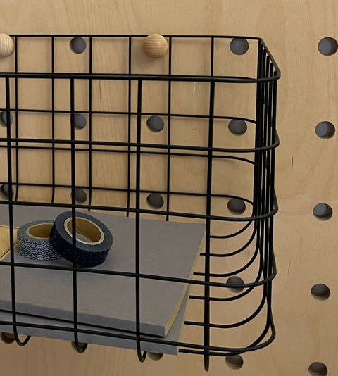 detail black wire basket for extra storage for pegboard