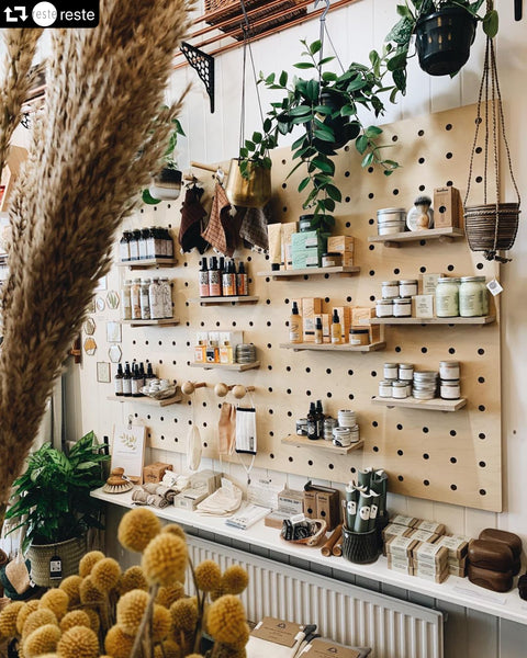 Wooden pegboards in retail store by Kreisdesign