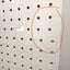Pegboard with misaligned holes highlighted by a red circle and text label.
