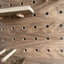 detail of walnut pegboard by kreisdesign 
