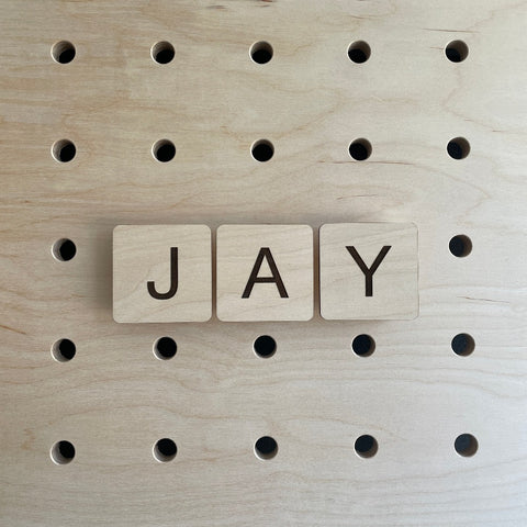 Wooden letters tiles for pegboards made from thin plywood
