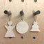 wood xmas hanging decorations on pegboard