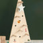 Wooden Christmas tree with holes to use as a pegboard with wooden peg hooks