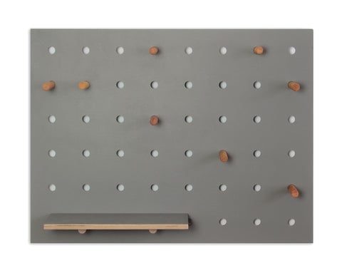 grey small wooden pegboard with shelf and pegs