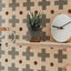 small wooden pegboard with cross pattern print with shelf and pegs