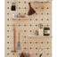 large wood pegboard with floral graphic print with shelves and pegs made by kreisdesign