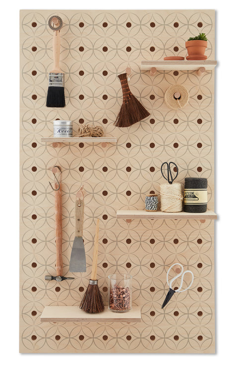 large wood pegboard with floral graphic print with shelves and pegs made by kreisdesign
