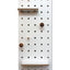 white wood pegboard with shelves and pegs