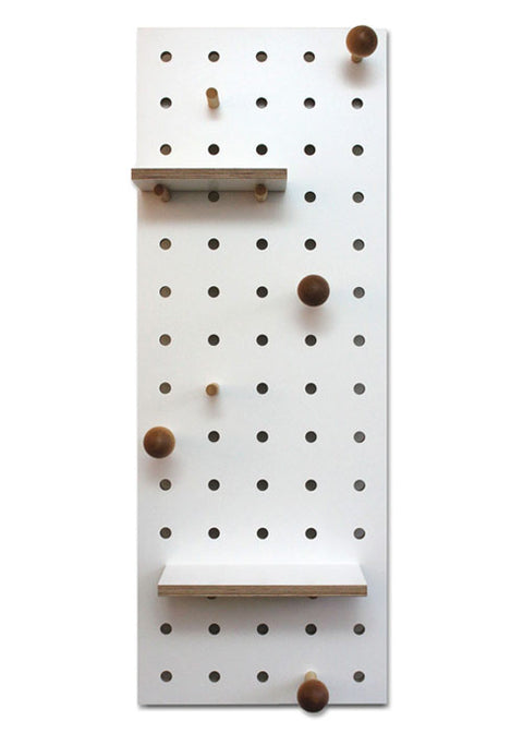 white wood pegboard with shelves and pegs