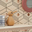 wooden shelf with bird toy 
