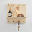 small wooden wall shelf with wooden pegs
