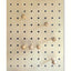 large wood pegboard with round pegs for hanging coats, bags
