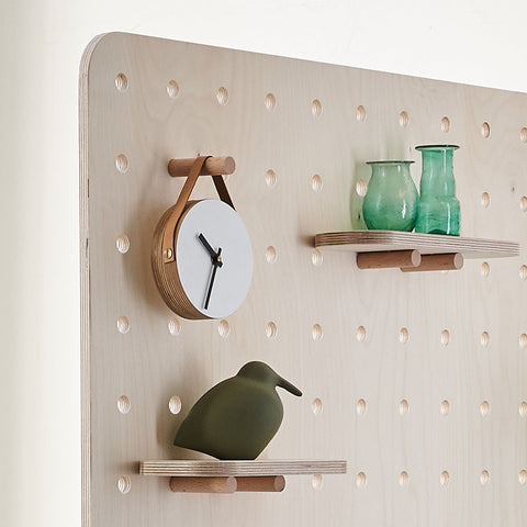 hanging clock shelf on wooden screen divider